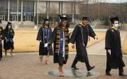 Old Dominion University's commencement exercises are filled with inspiration and moments of joy as graduates walk across the seal on Kaufman Mall. Photo Chuck Thomas/ODU